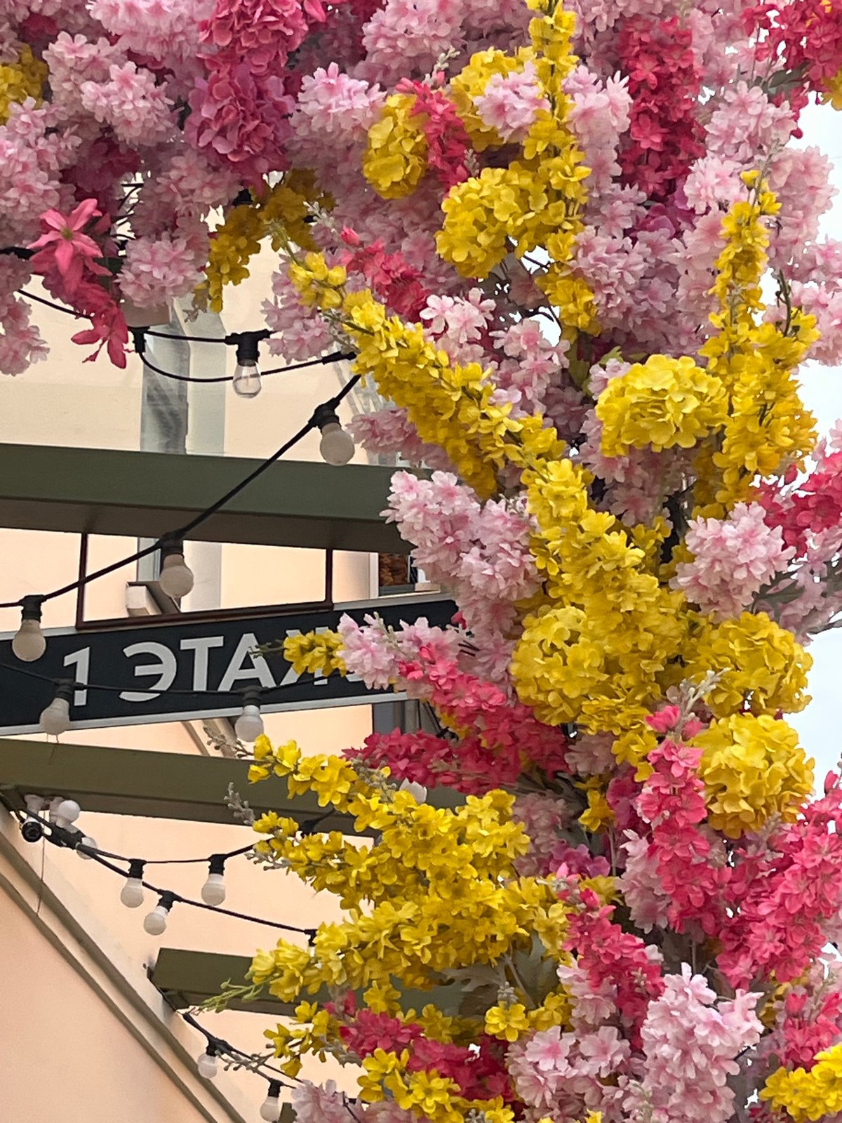 Decorative flower archway installed at building entrance in Izhevsk