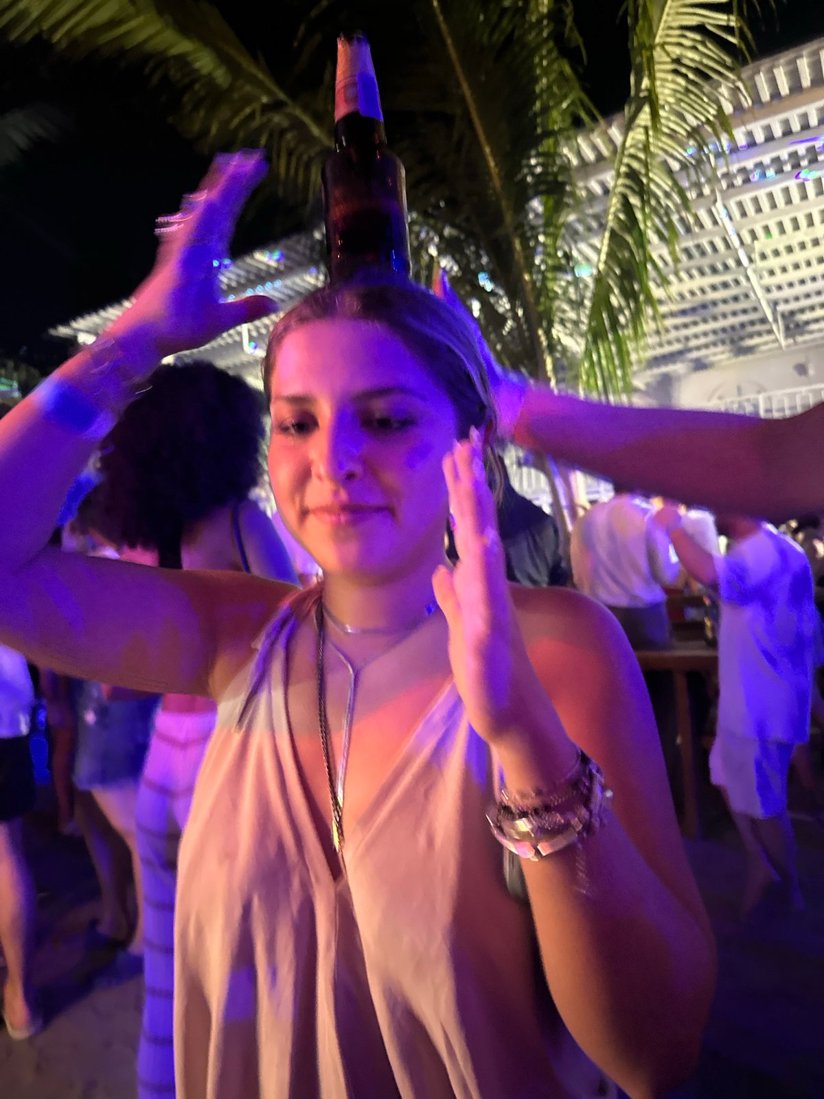 Women celebrate with drinks at Brisas de Zicatela venue