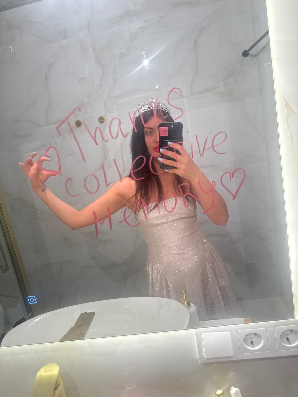 Woman takes mirror selfie in Moscow bathroom