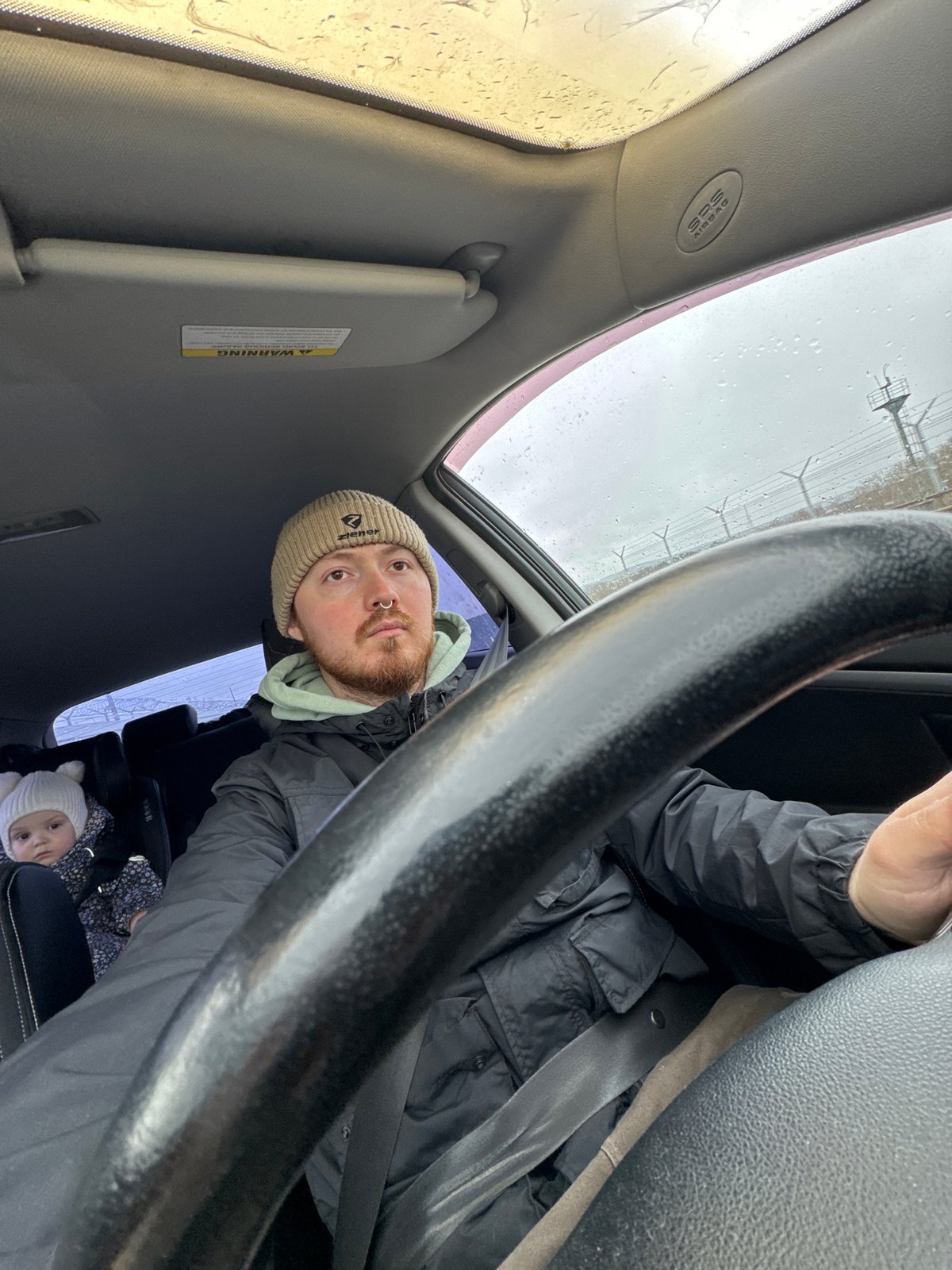 Driver and child observed in vehicle during morning hours
