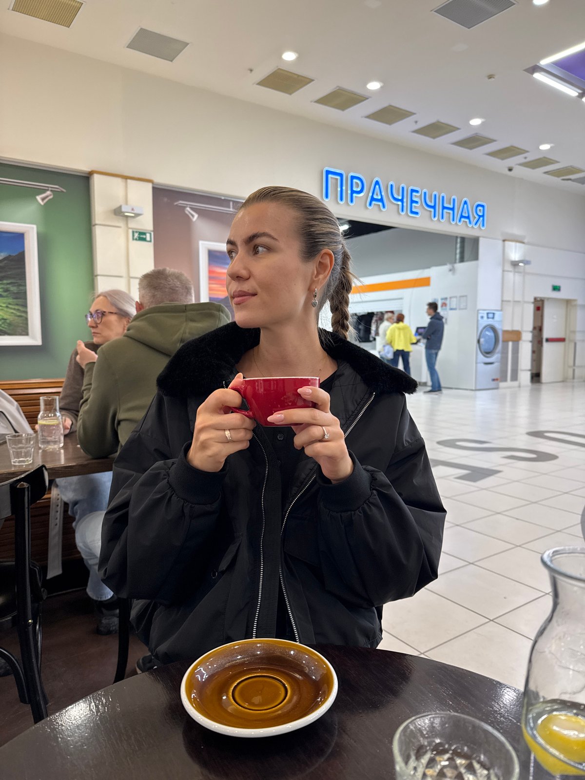 Woman with pink phone documented across multiple indoor locations
