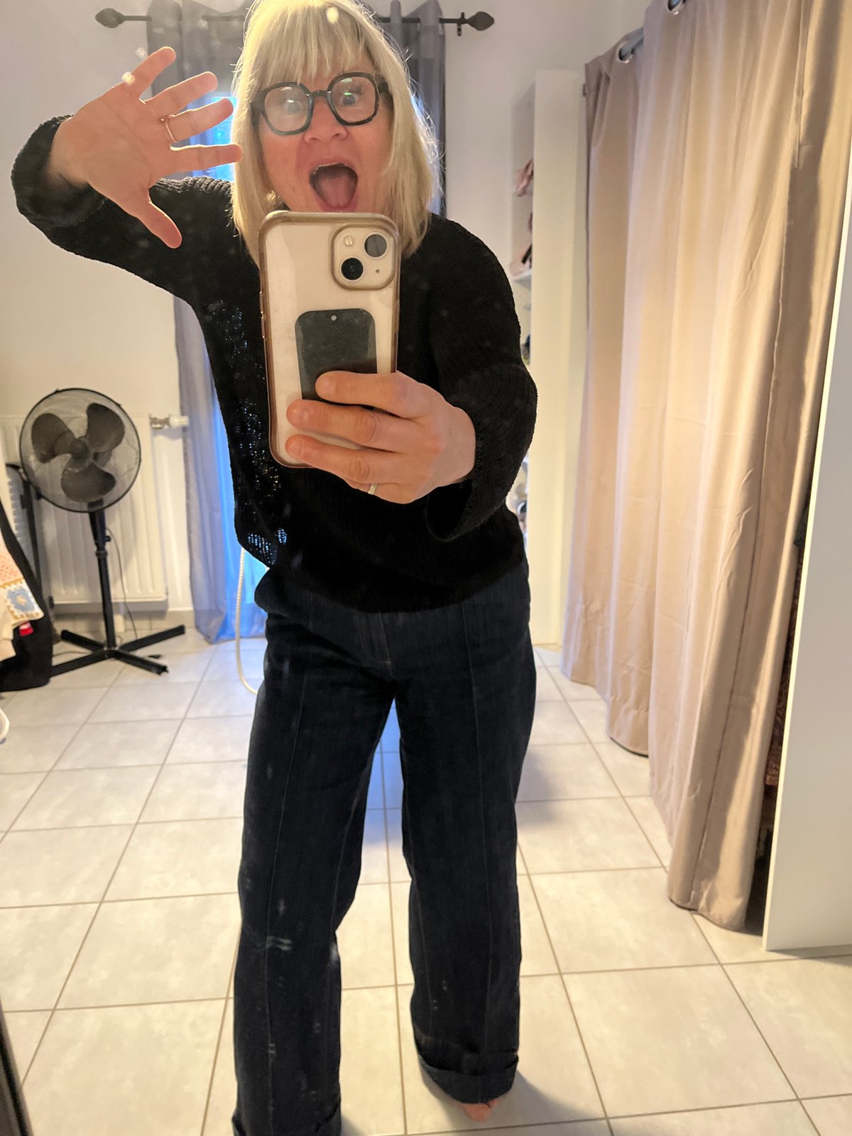 Woman takes mirror selfies in Chambœuf, France early morning