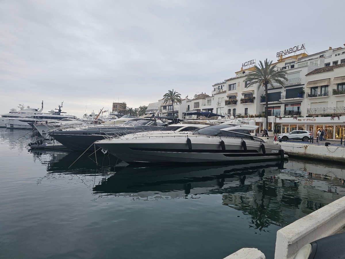 Afternoon scenes from Marbella marina district under overcast skies