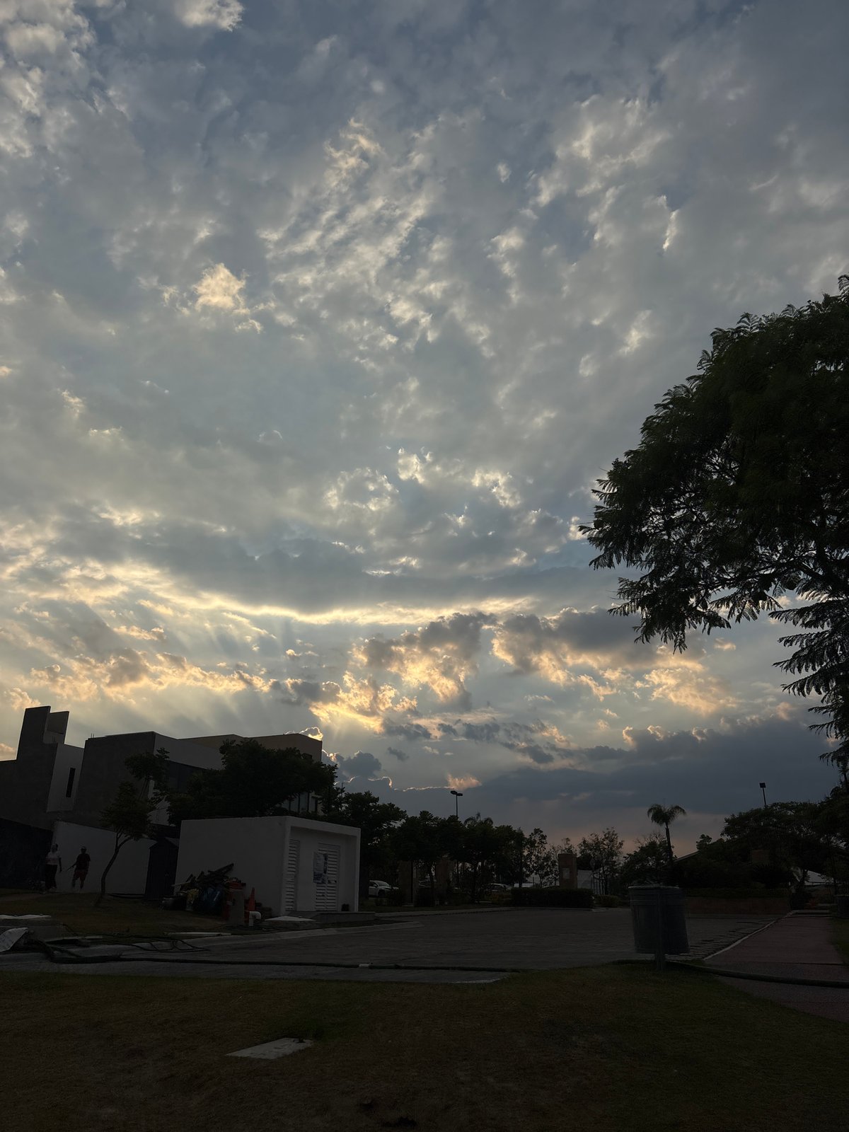 Golden sunset observed through mixed clouds in Santa Clara Ocoyucan