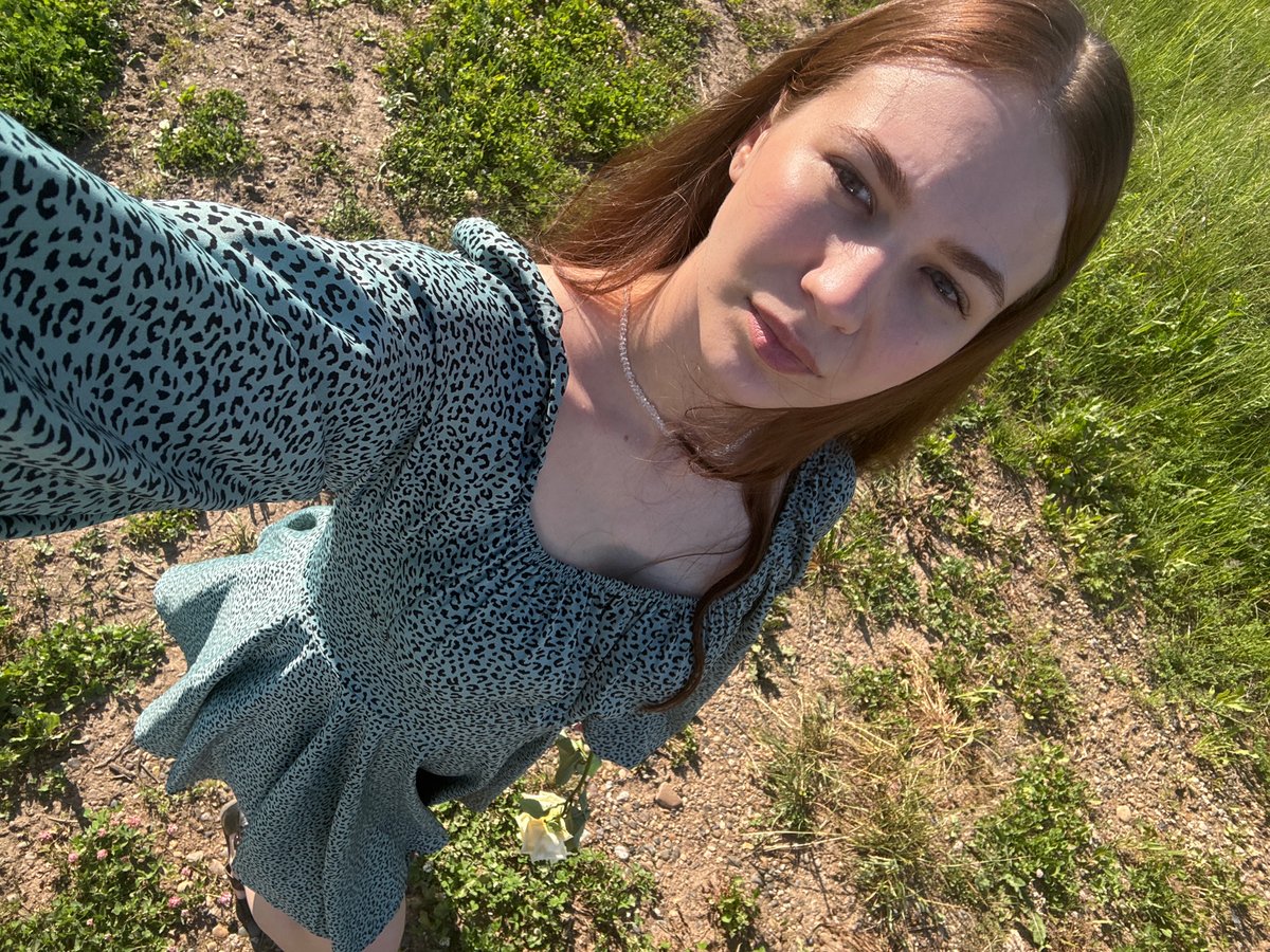 Woman with yellow rose photographed in Russian field