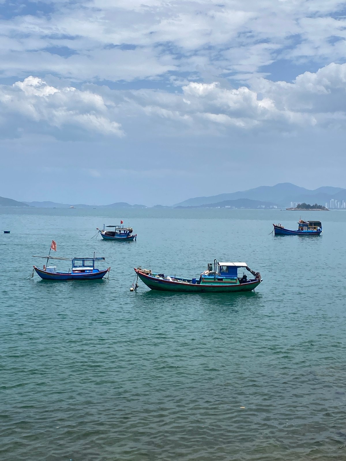 Nha Trang fishing harbor, boats at rest on a calm morning