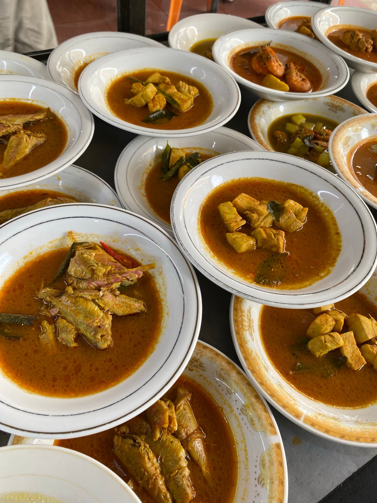 Banda Aceh street food stall serving fish curry and omelets
