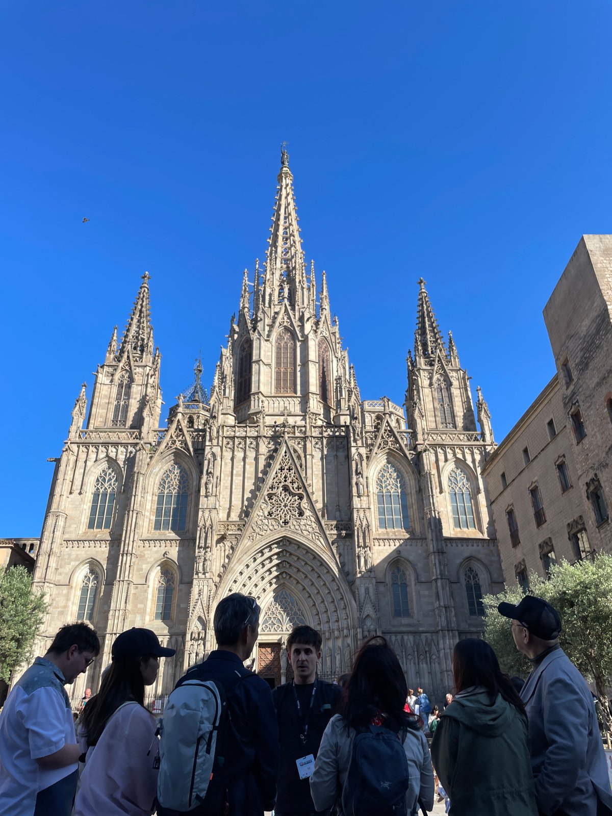 Female duo busks outside Barcelona Cathedral drawing afternoon crowds