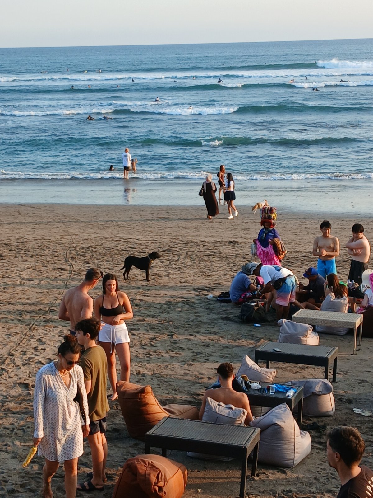 Late afternoon at North Kuta beach — surf, music, and sand vibes