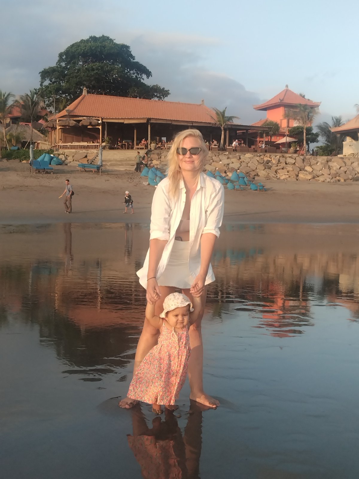 Woman and children spotted at beach during evening hours