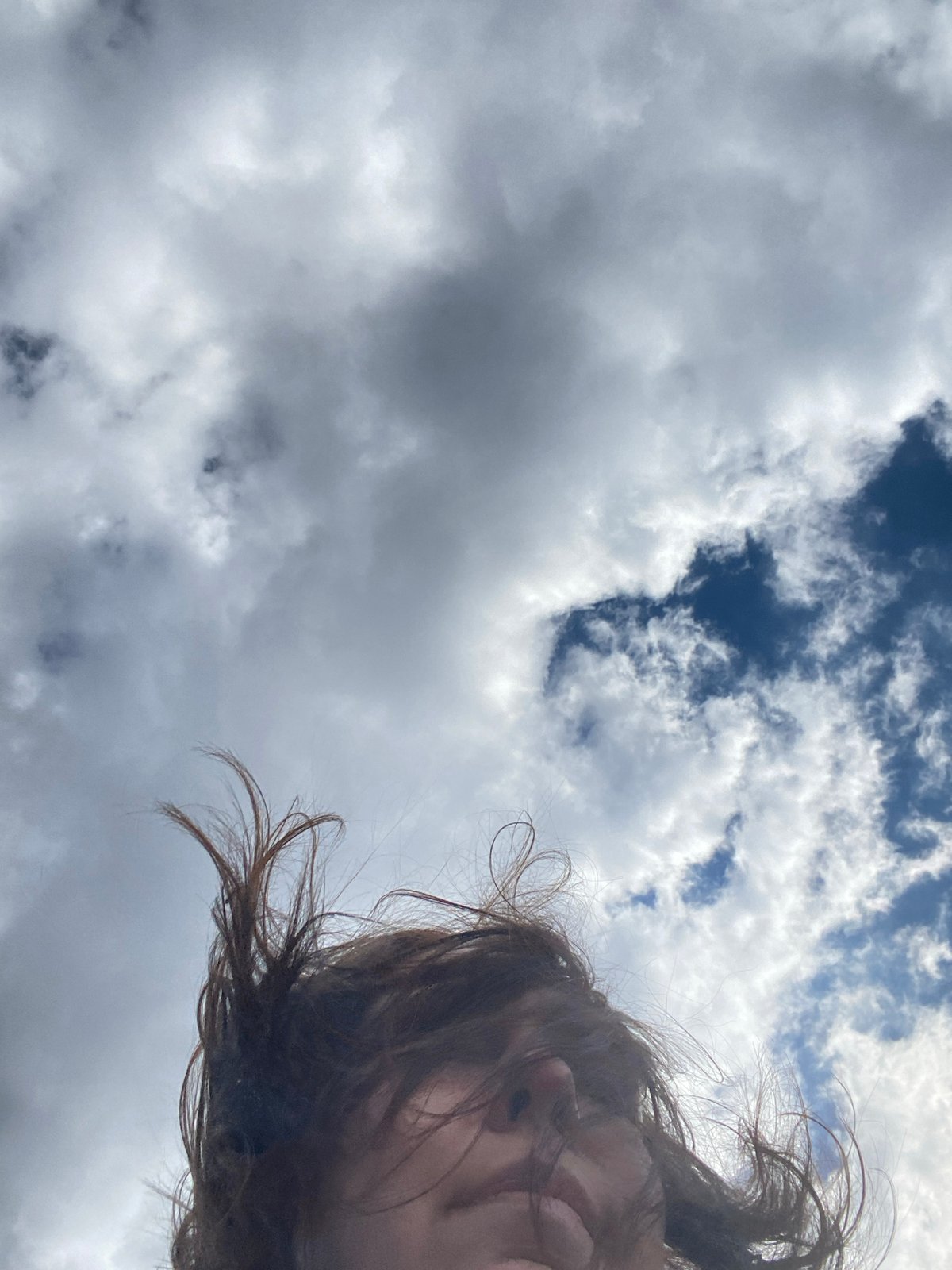 Person photographed against cloudy sky in Nizhnie Yaki, Russia
