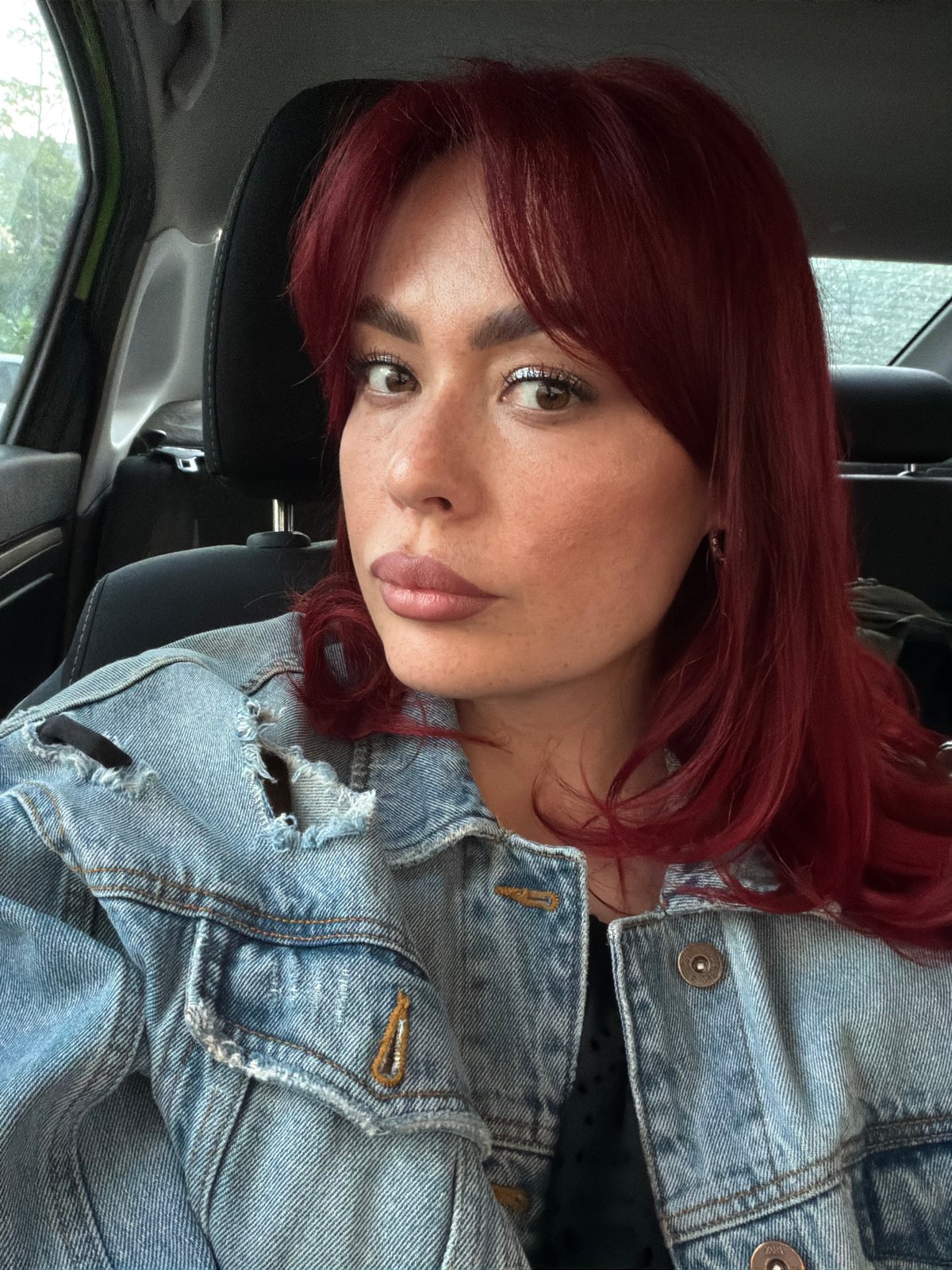Close-up selfie pair, red hair and denim, Togliatti