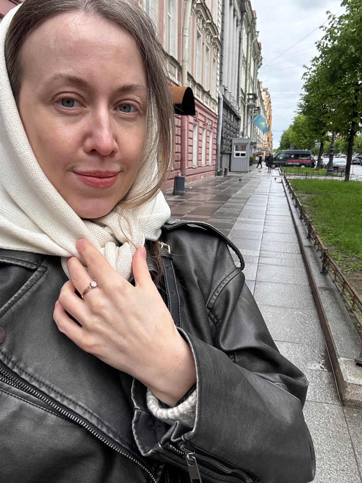 Woman takes selfie on historic Saint Petersburg street