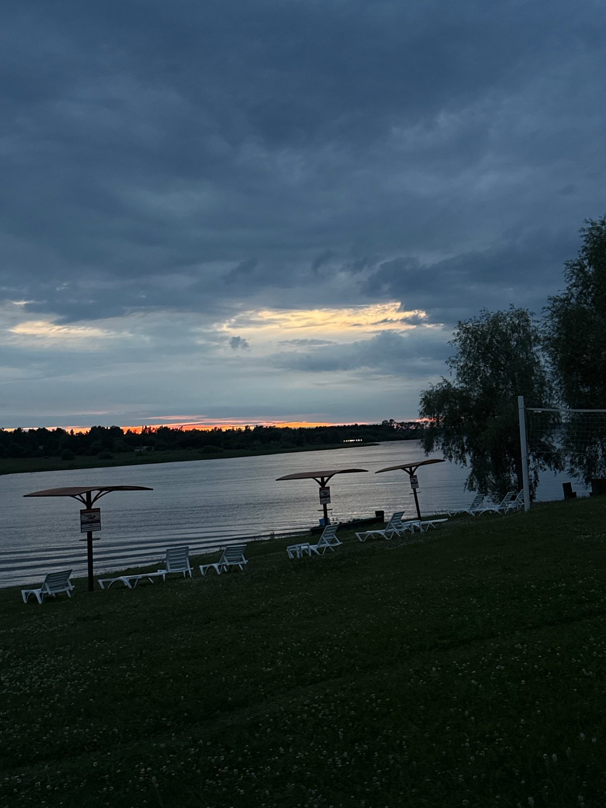 Sunset over a calm lake in Elovo, Russia