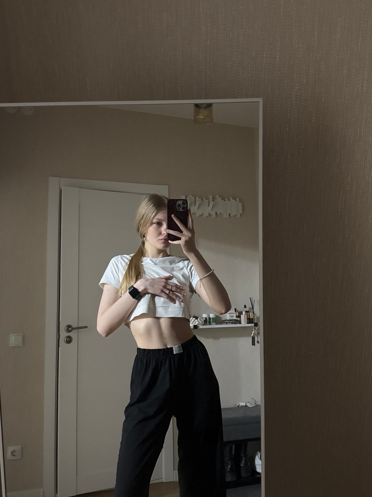 Woman takes series of mirror selfies in Perm apartment