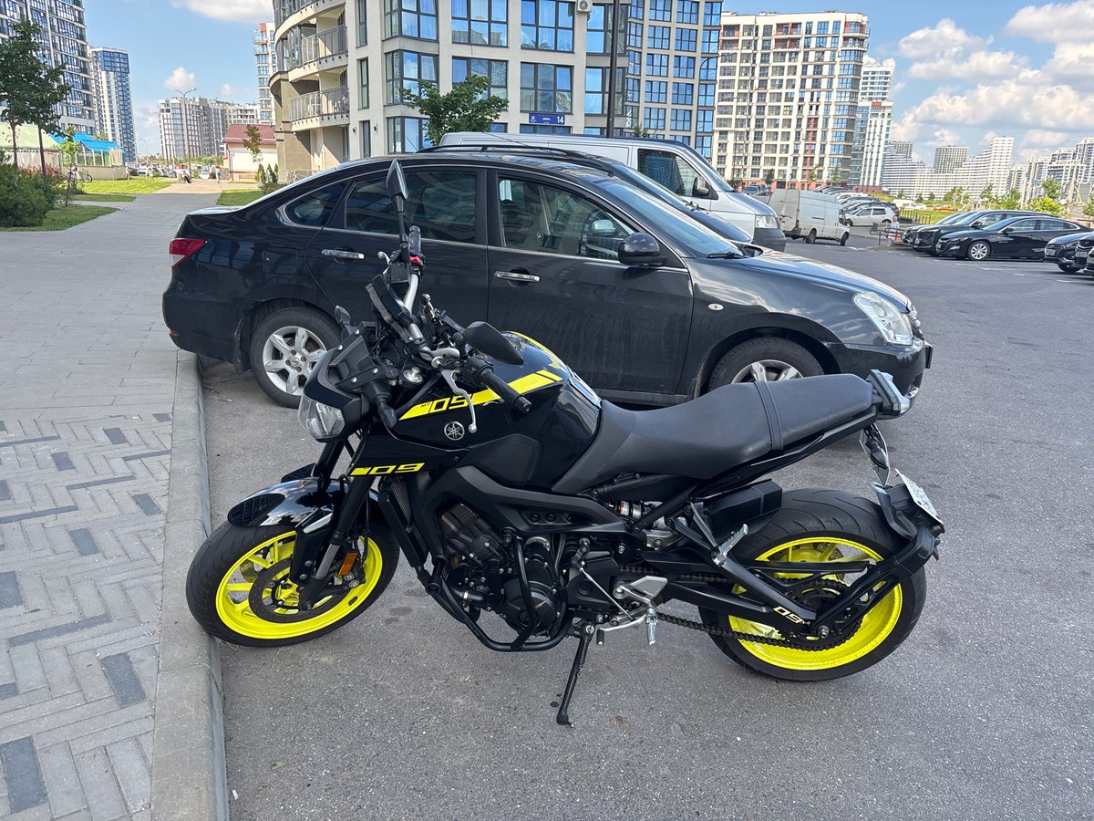Modern residential complex in Minsk, motorcycle parked out front