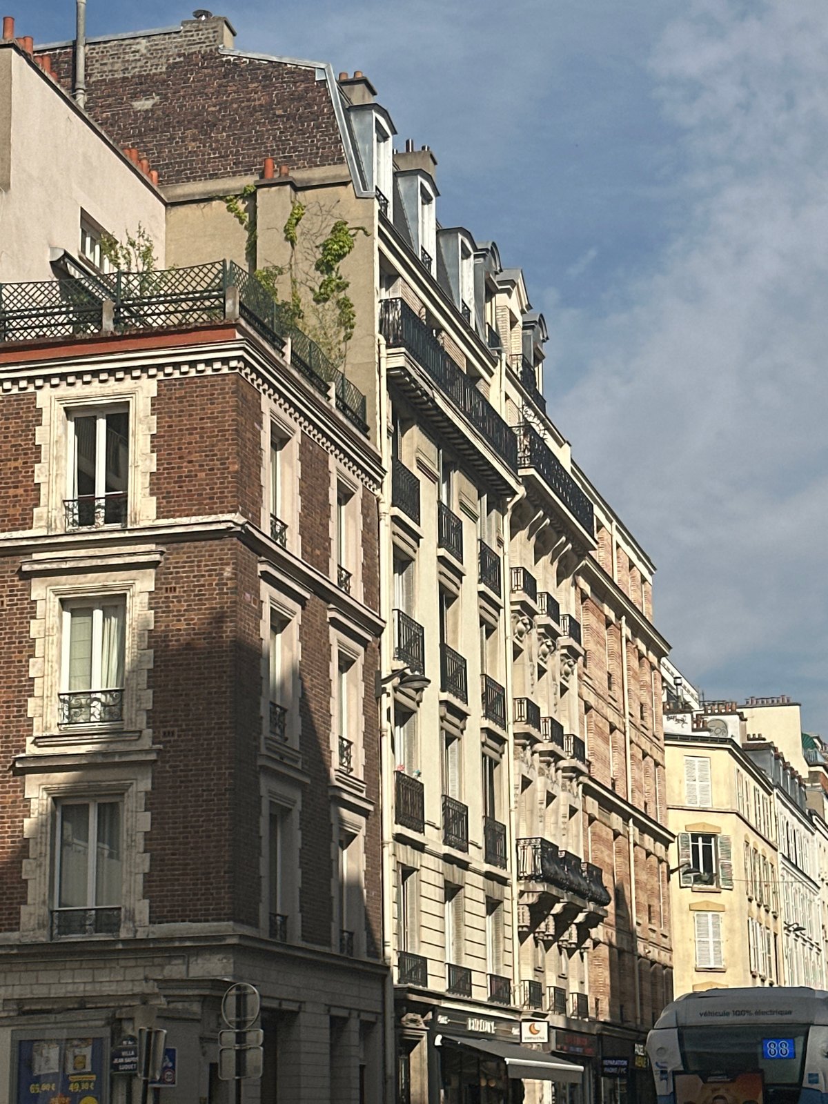 Street-level tour of classic Parisian architecture on a summer afternoon