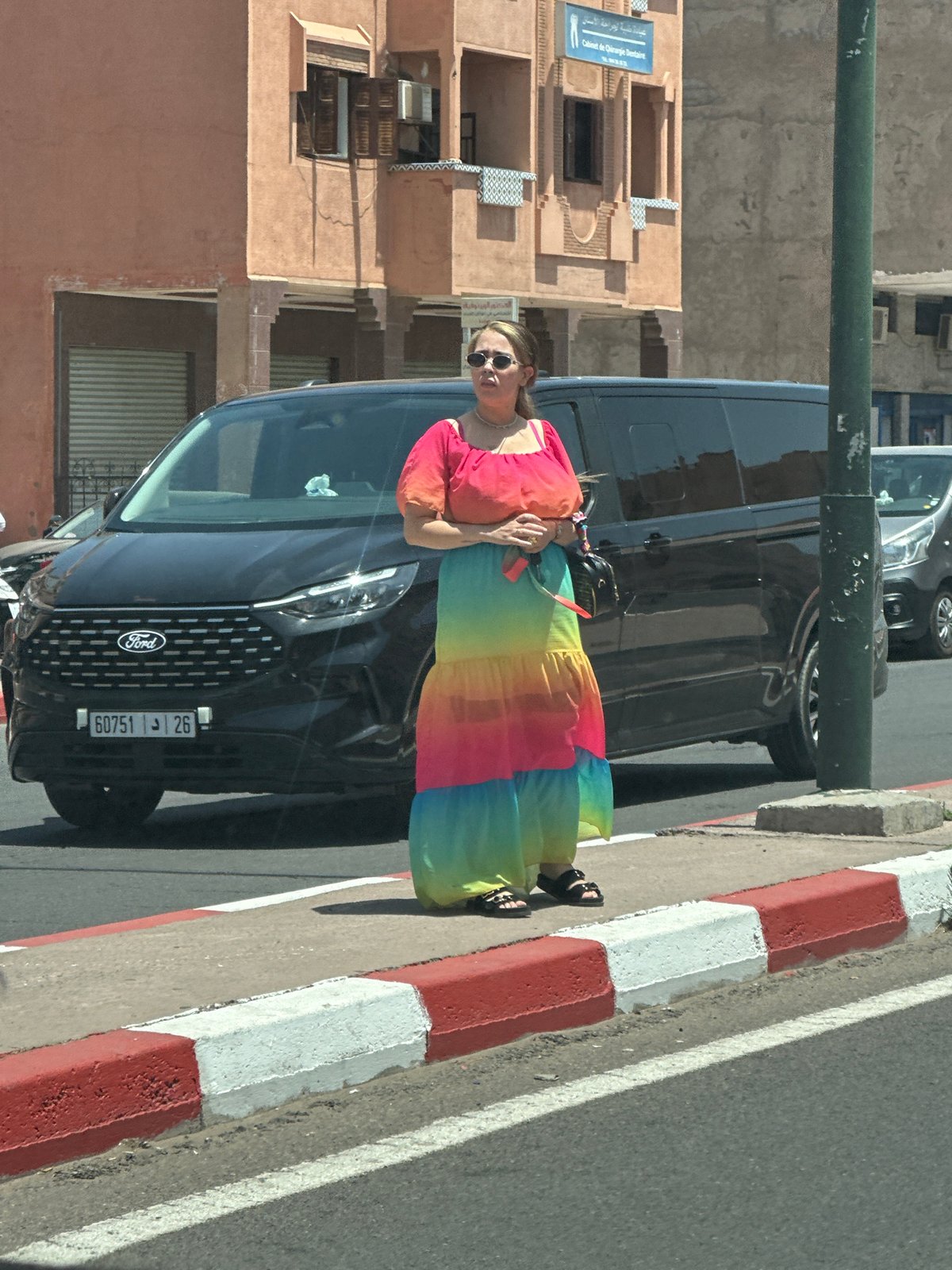Woman in rainbow dress photographed near disguised cell tower