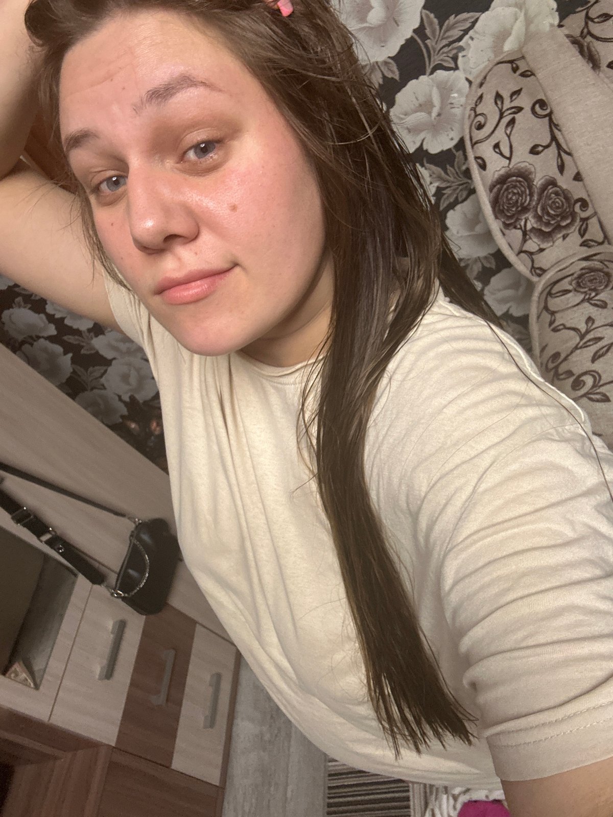 Woman takes multiple mirror selfies at home in Russia