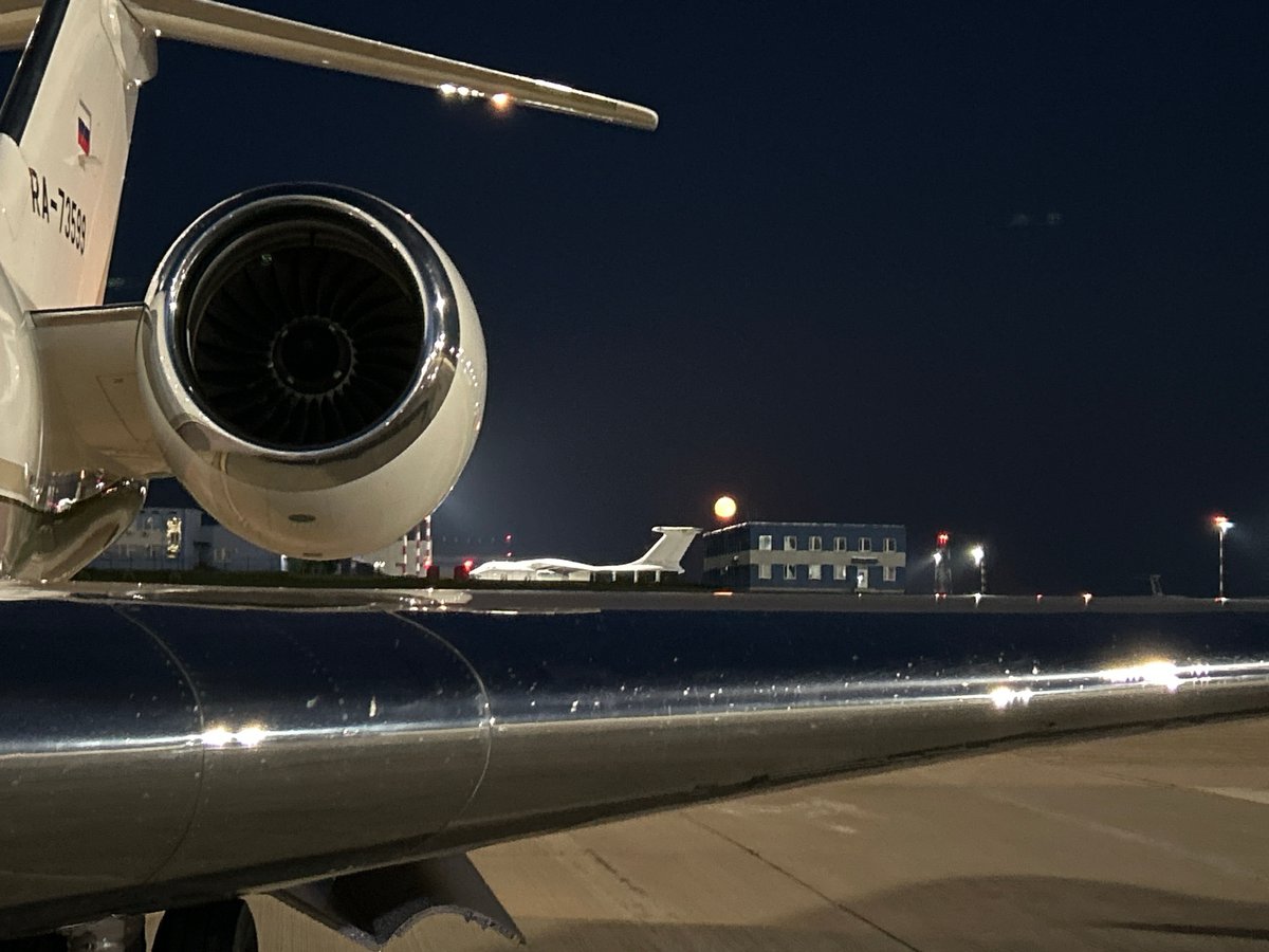 Corporate jet on the tarmac at Minsk Airport, late night