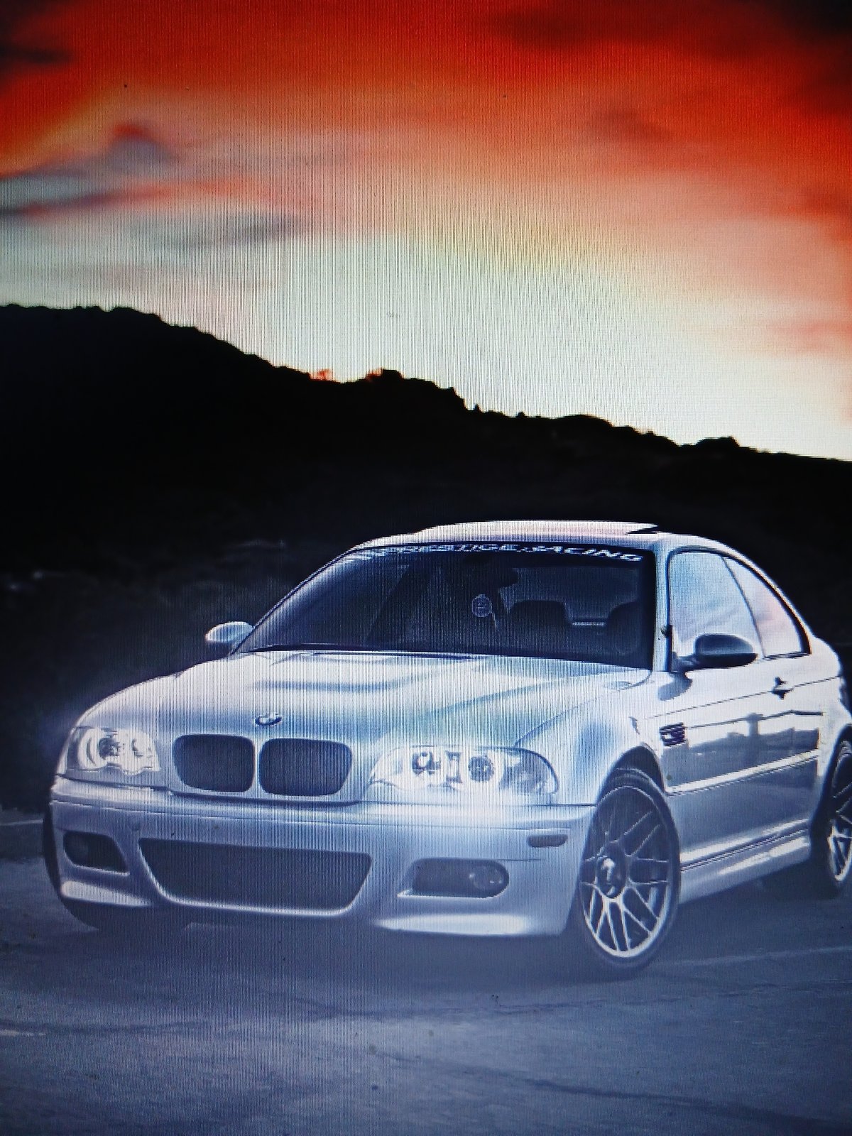 Scattered personal photos, cars, and warehouse scenes with no clear location