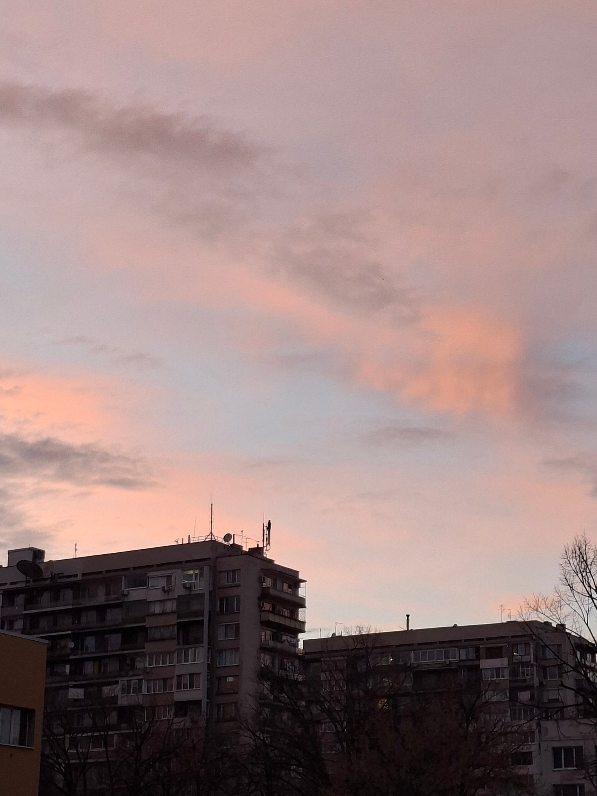 Evening sunset observed over Plovdiv residential buildings and park
