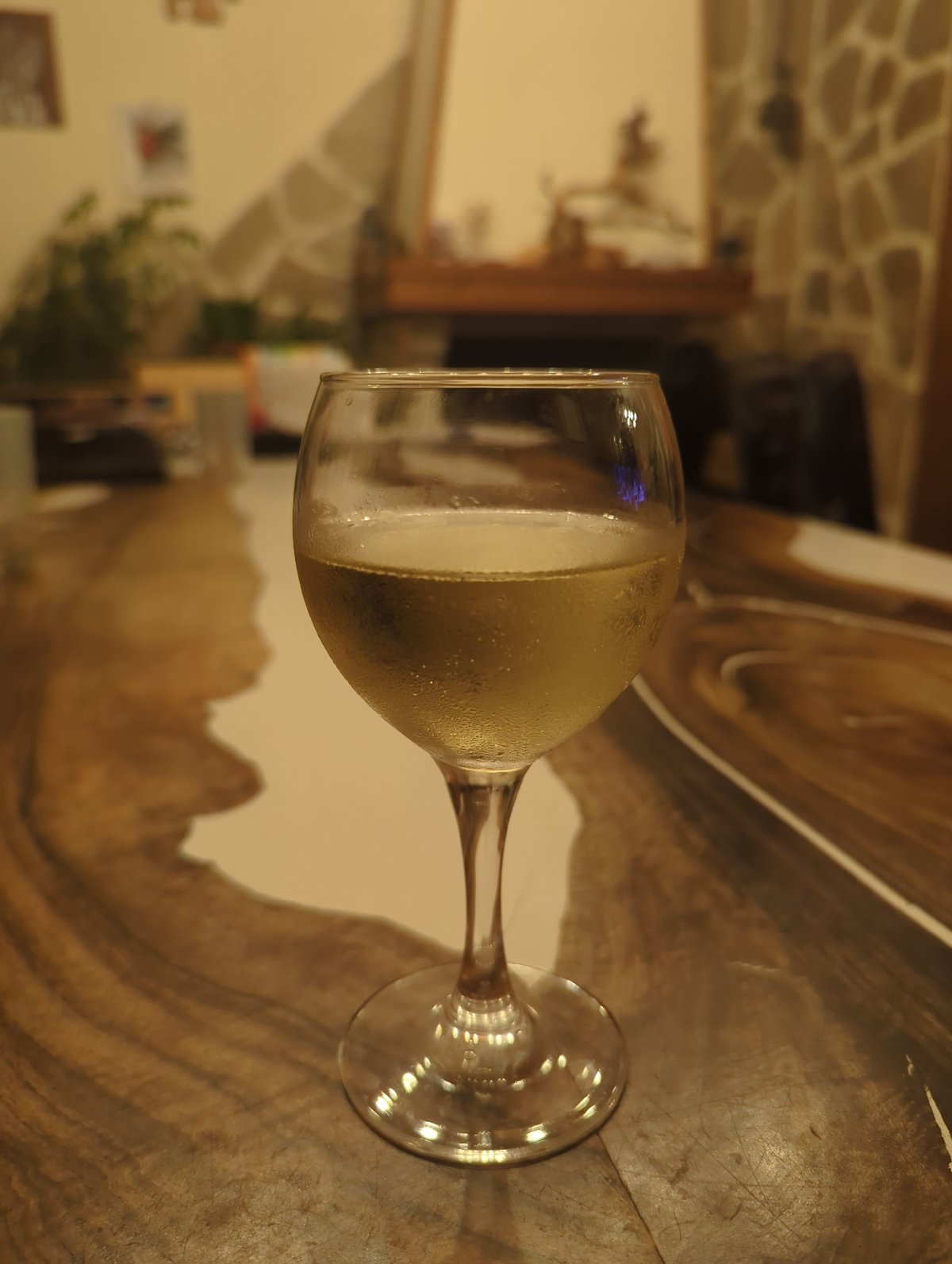 Champagne glass spotted on wooden surface in Septemvri interior