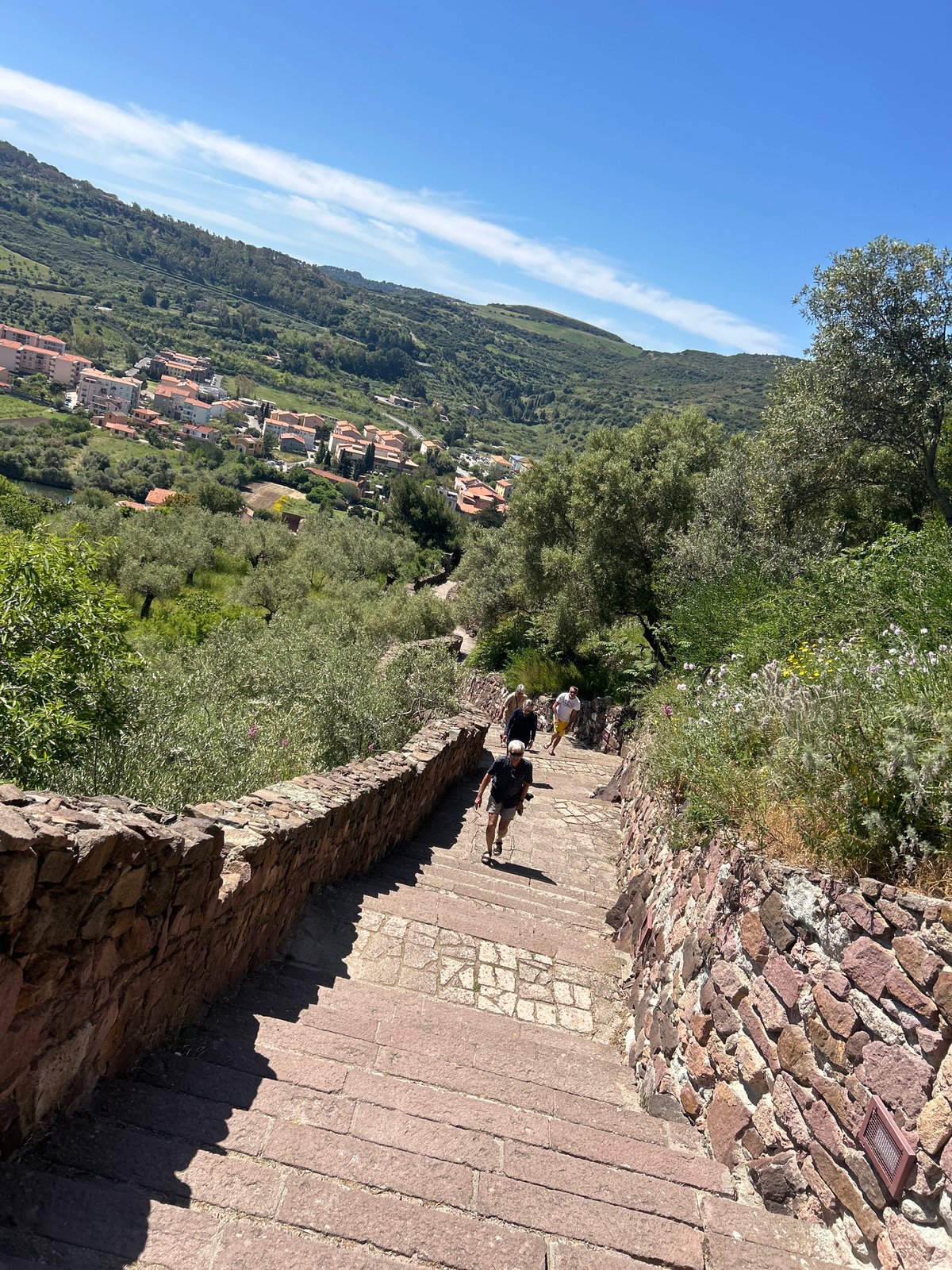 Tourist explores historic fortress complex in Bosa, Italy