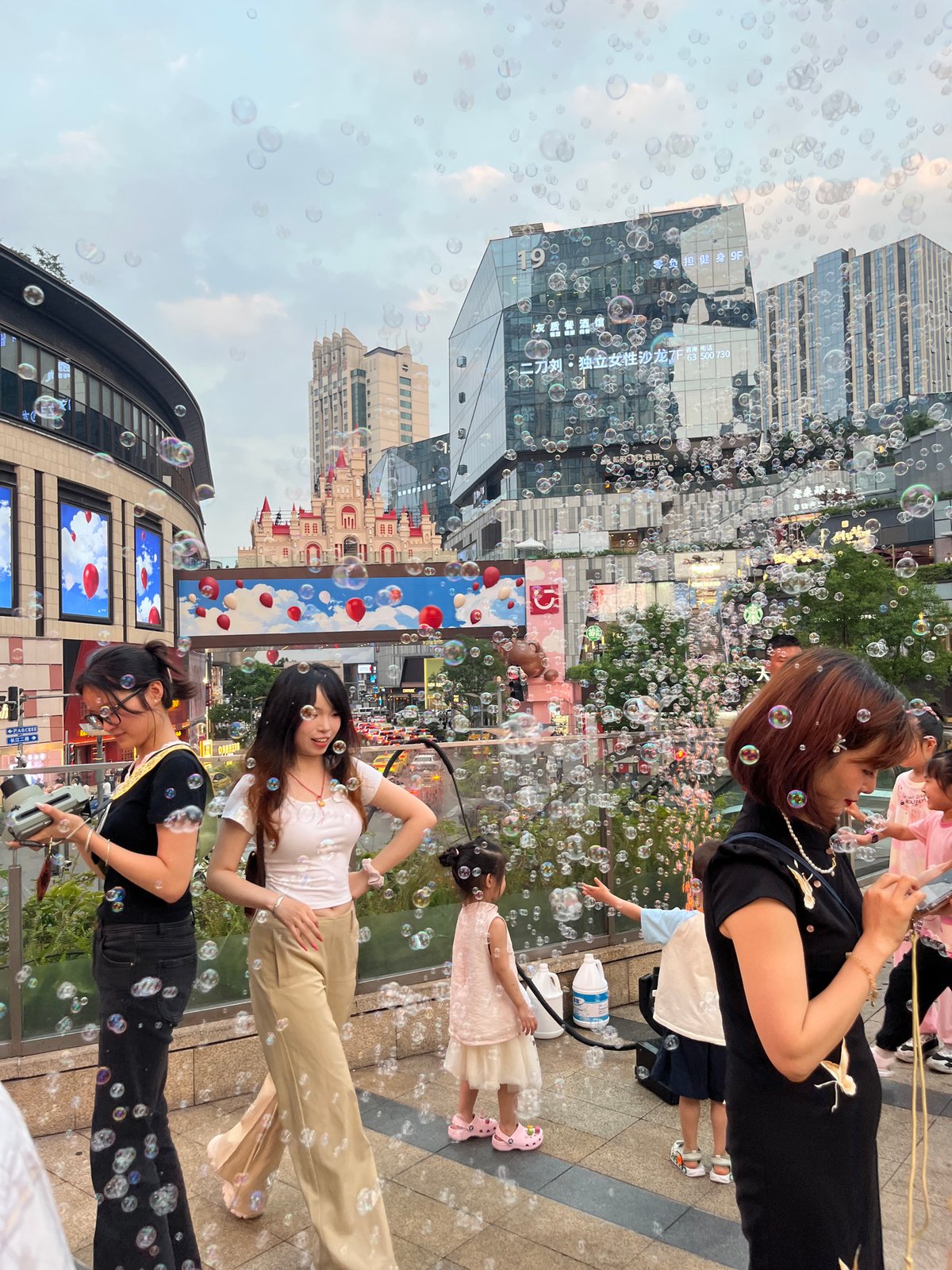 Soap Bubbles Fill Busy Pedestrian Areas in Yuzhong District