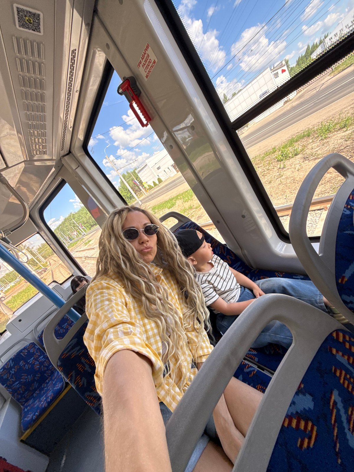 Woman and child travel by bus in rural Russia
