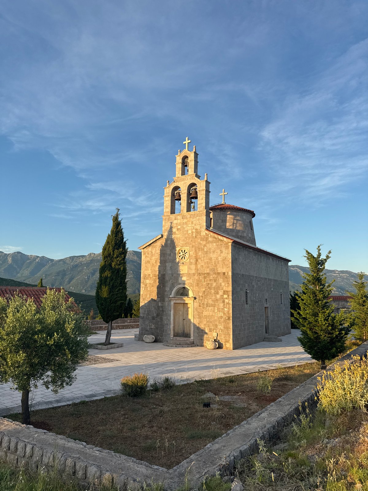 Sunset over Kovačko Polje — churches, coast, and close-up ground life