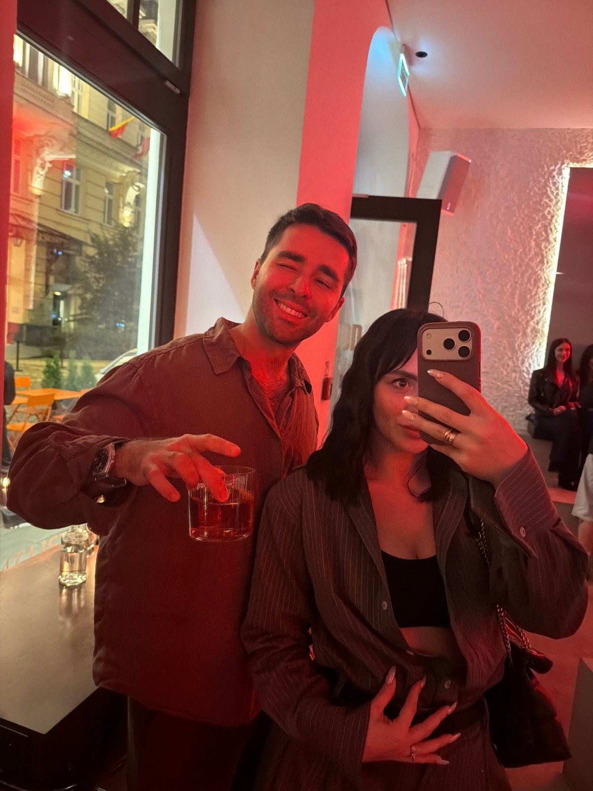 Evening bar scene in Warsaw, selfie and city lights