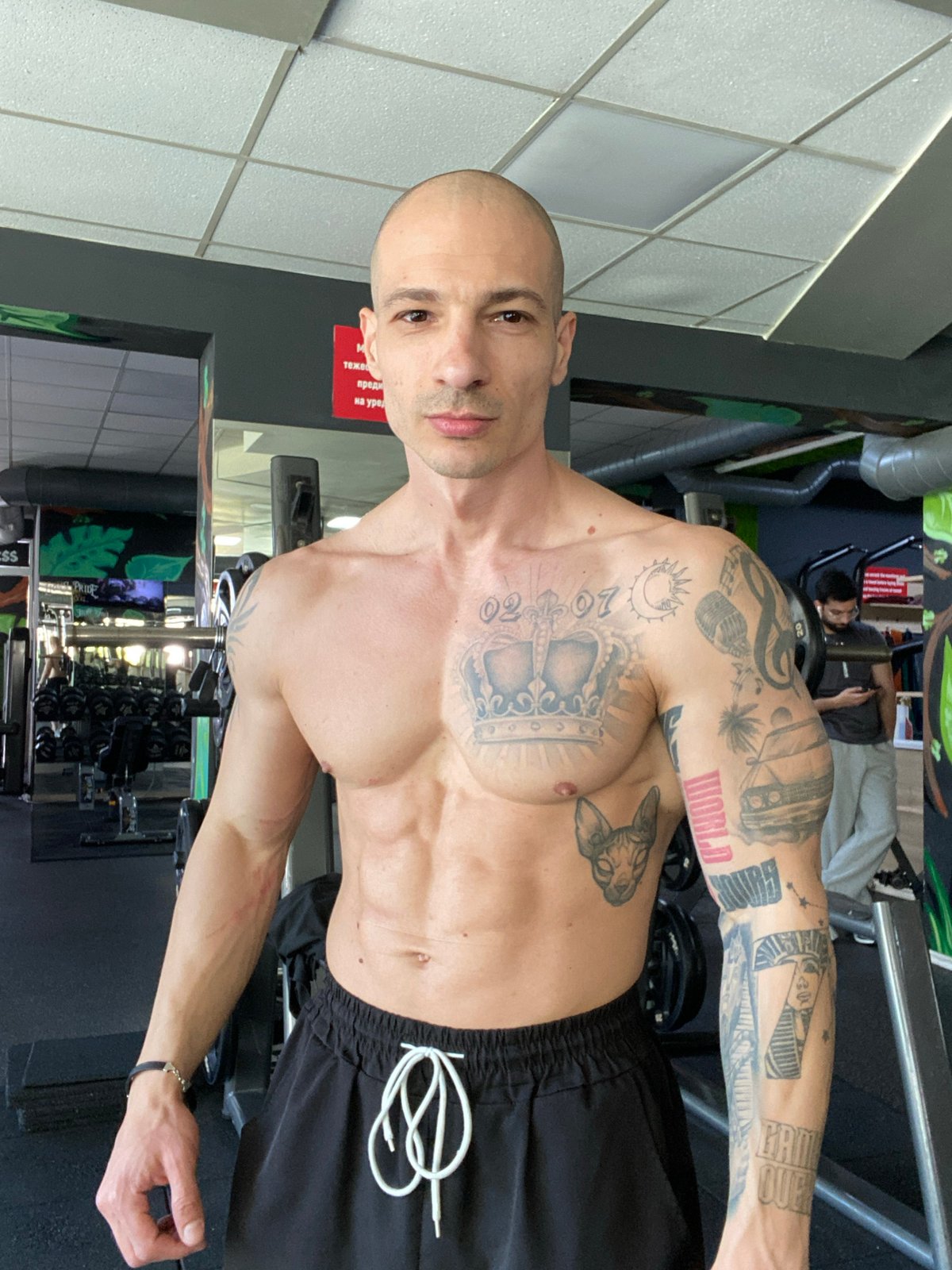 Man poses in gym in Pleven, Bulgaria