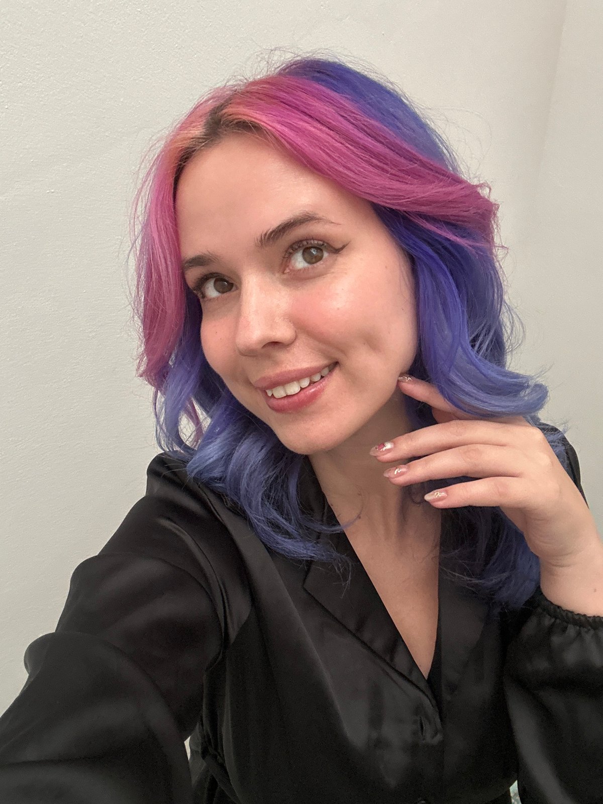 Woman takes colorful-hair mirror selfies in Zagreb apartment