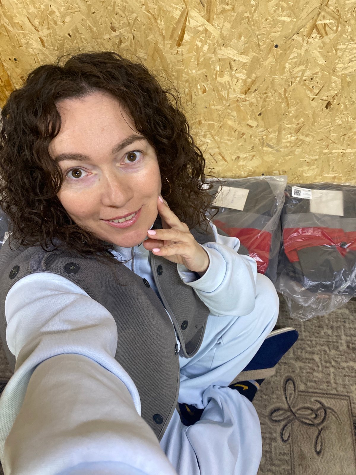 Woman relaxing indoors with pen and mug in Ol'khovskoye