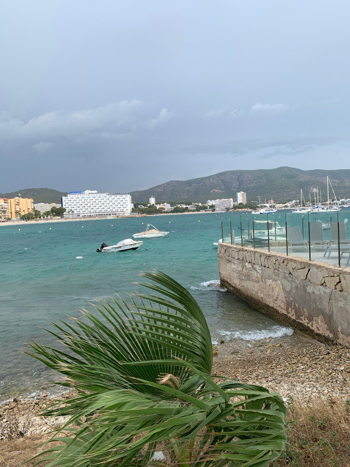 Choppy bay and sailboats along the Calvià coastline