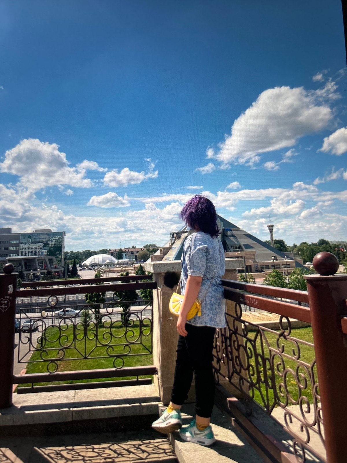 Sunny city outing with a victory pose and purple hair