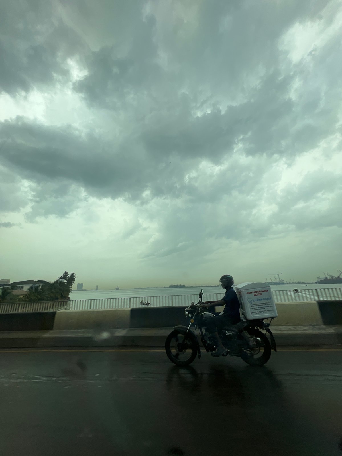 Medical courier delivers samples via motorcycle in Ikoyi