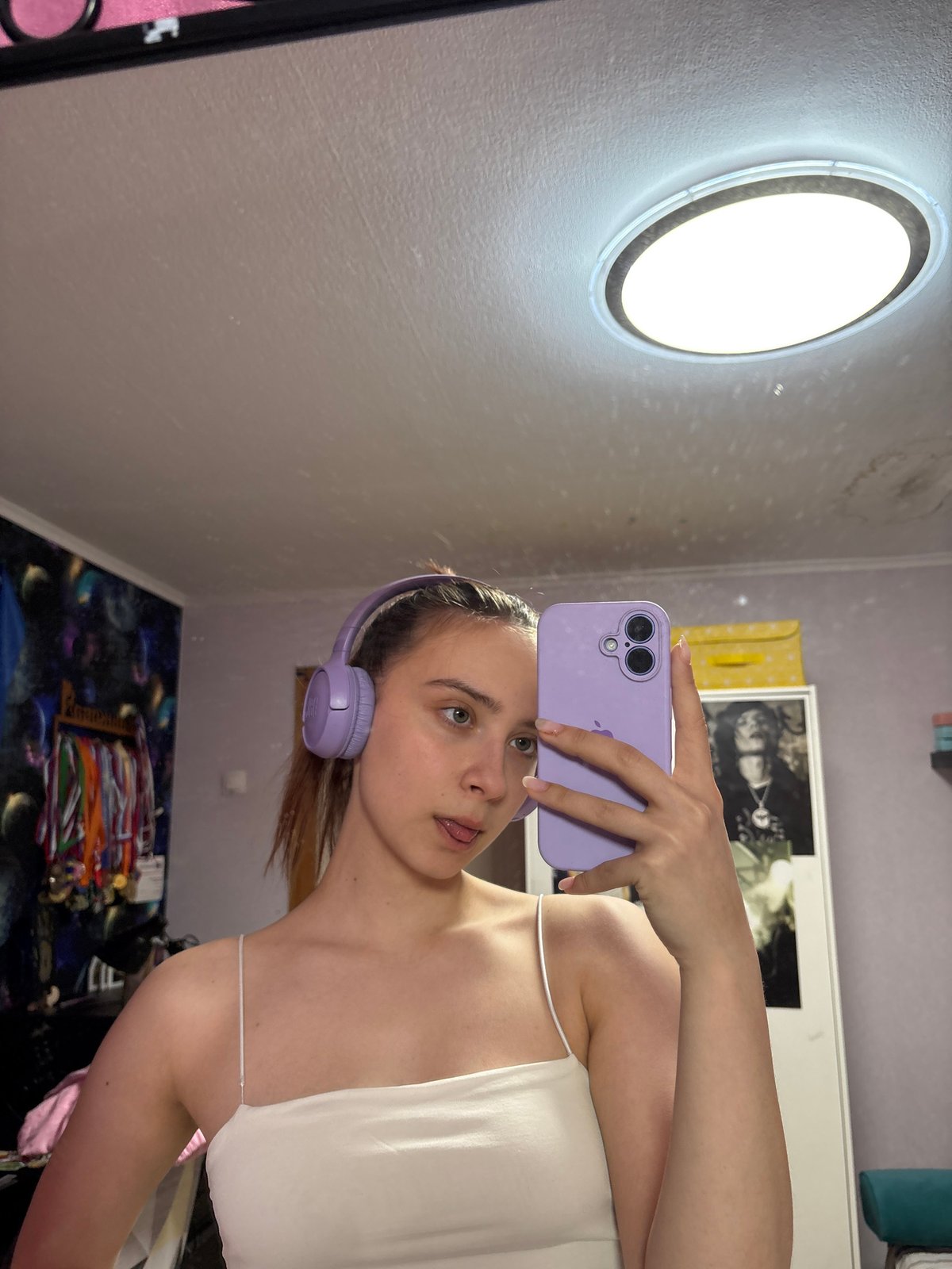 Woman takes mirror selfies in Прикамский home Wednesday morning