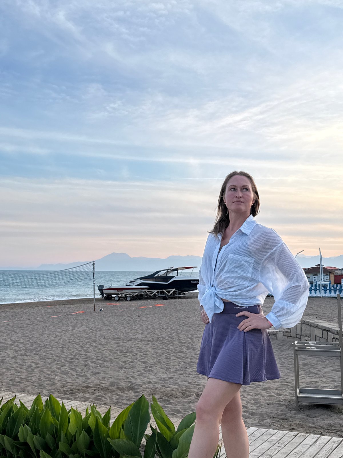 Woman photographed at sunset beach resort in Serik, Turkey