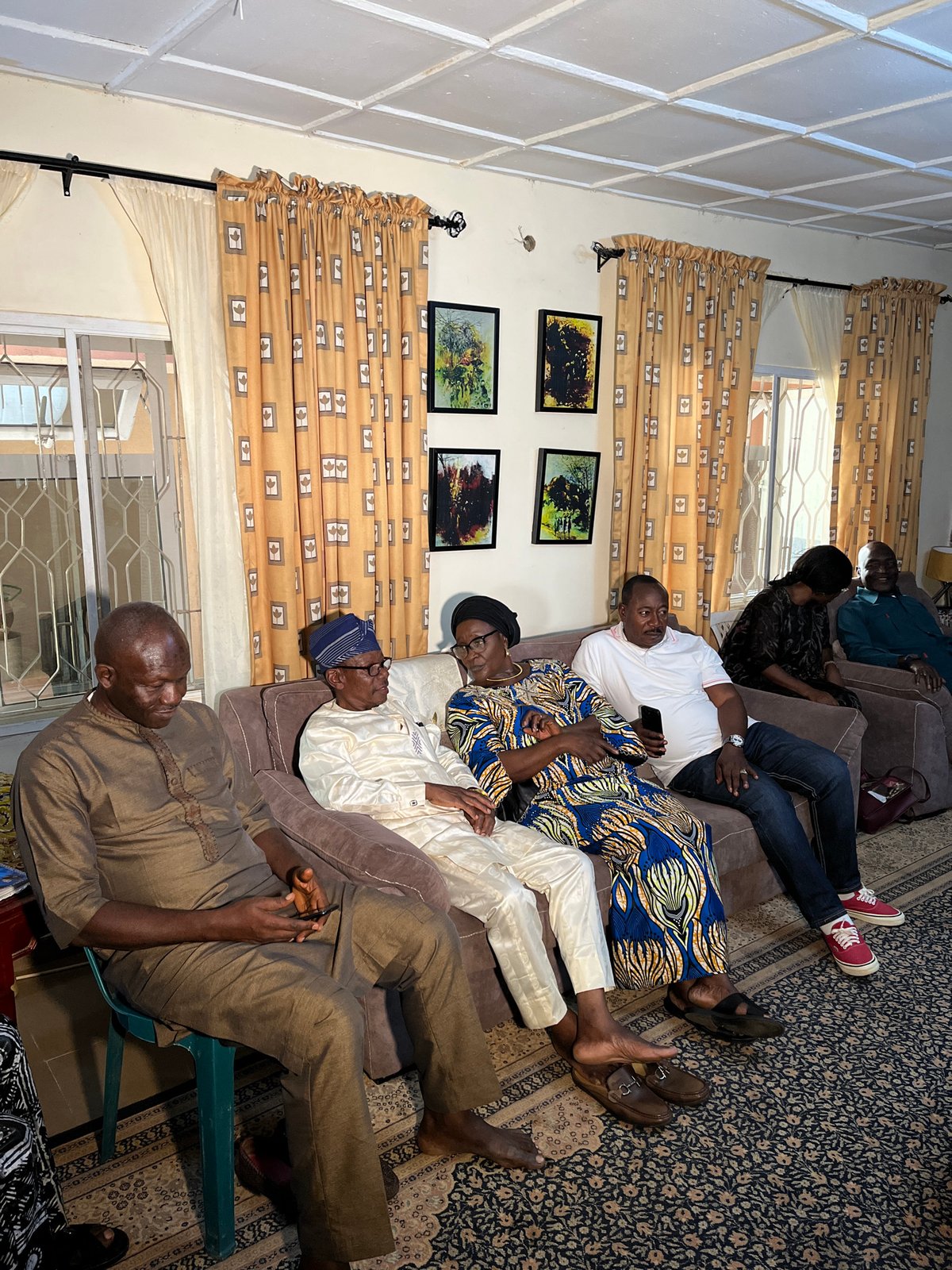 Indoor gathering in Bukuru living room