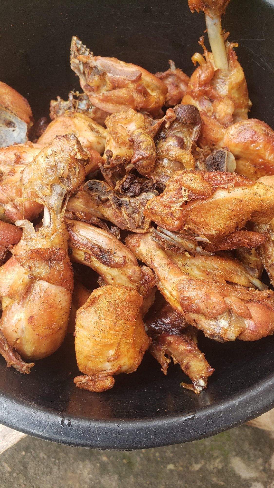Big outdoor cook-up in Sabon Tasha: fire, rice, and fried chicken