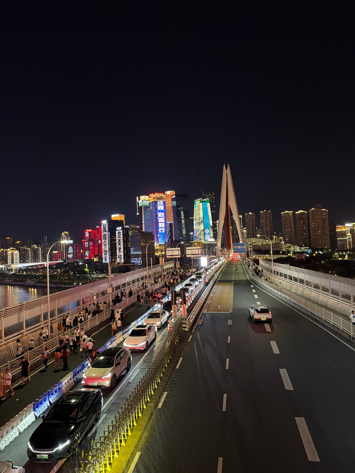 Chongqing's Yuzhong waterfront buzzing on a summer night