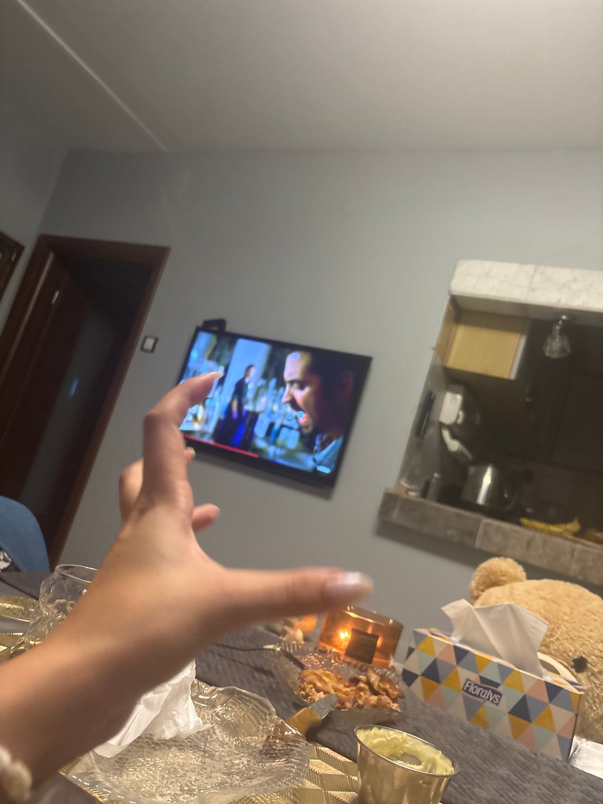 Indoor World Cup viewing party with selfies and personal items