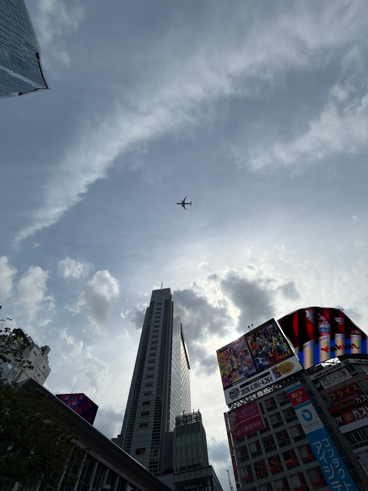 Aircraft spotted over Shibuya skyline during morning hours