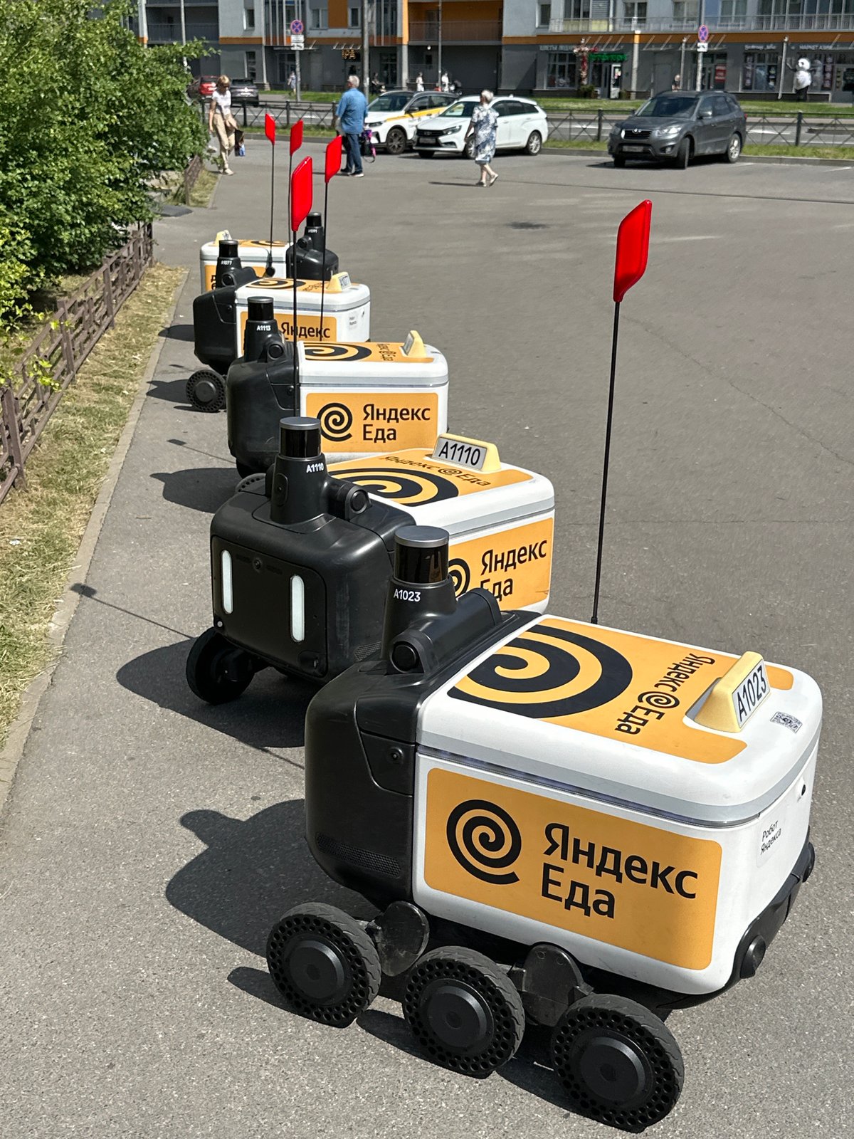 Yandex Food delivery robots parked in a row, Murino