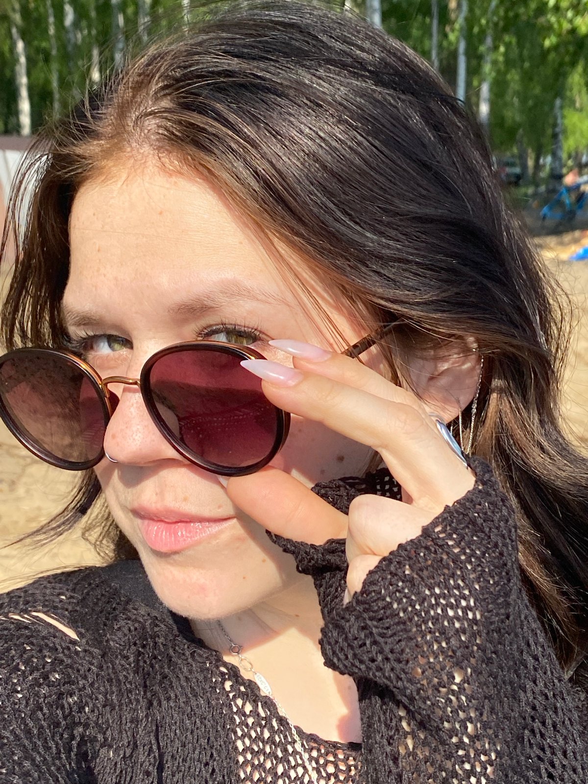 Woman photographed in outdoor portrait, car selfie in Chaikovsky