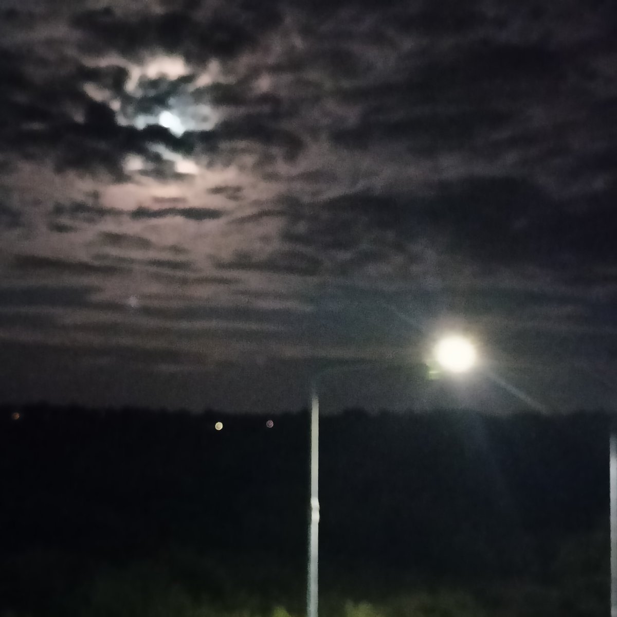 Full moon over Limerick's nighttime roads, late July