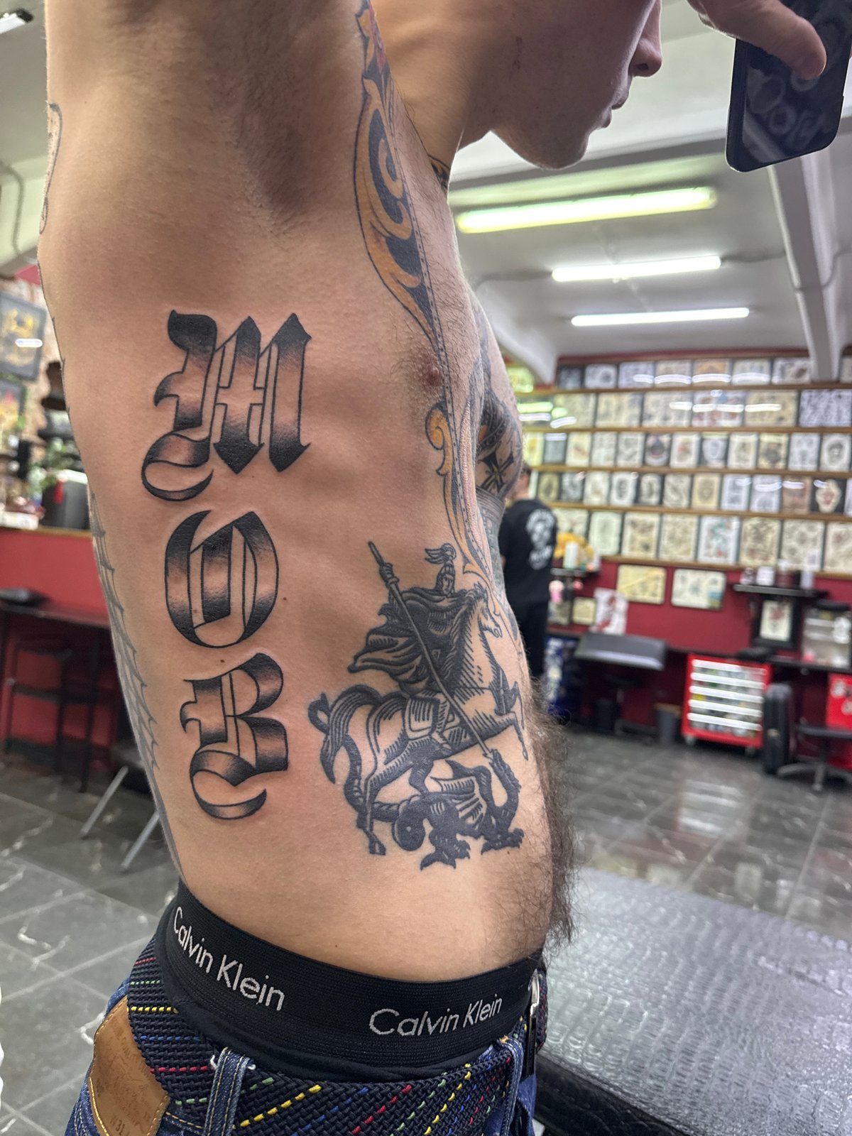 Elaborate tattoo artwork observed on individual's leg in Moscow
