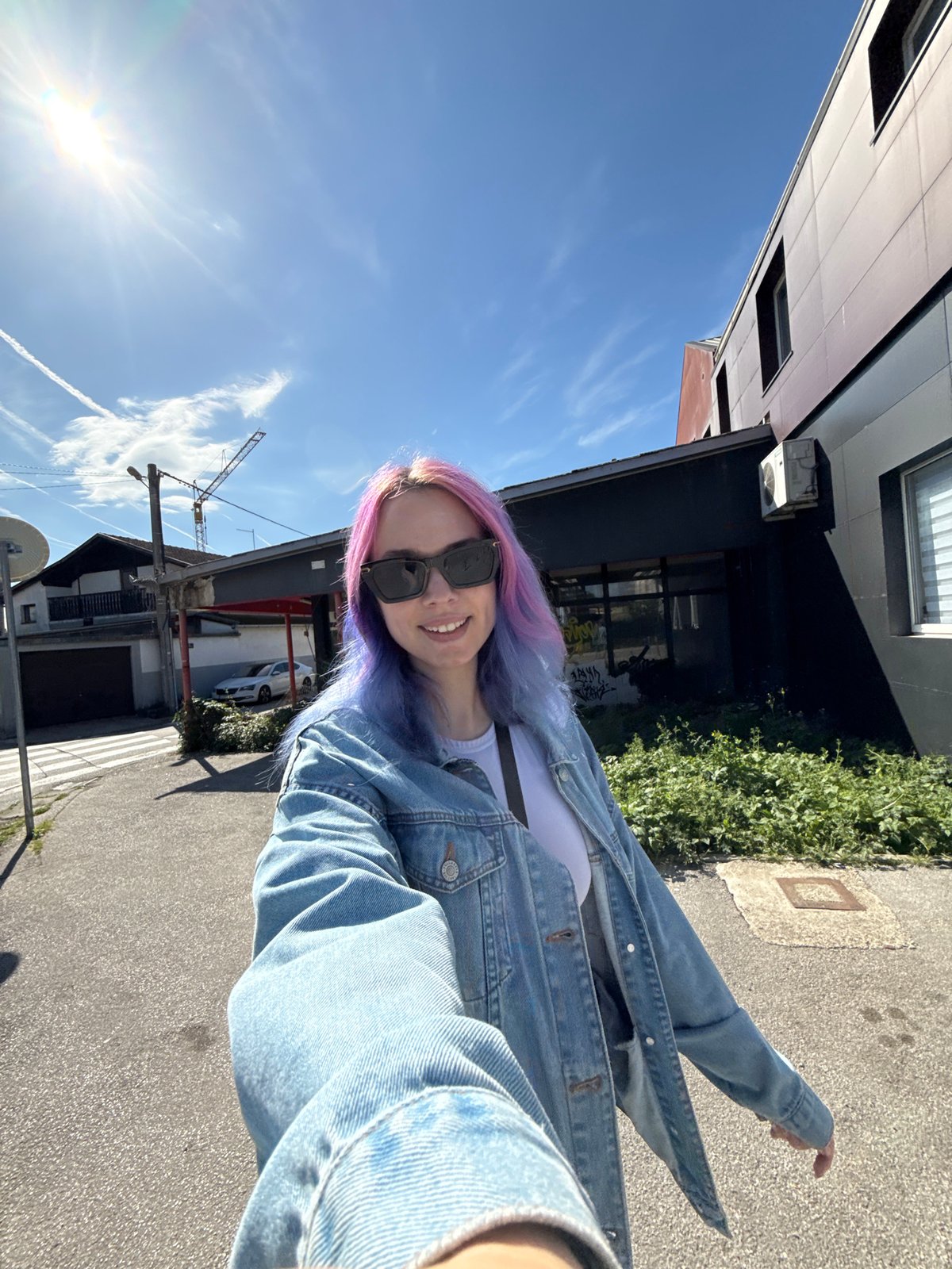 Woman takes colorful-haired selfie in Zagreb streets